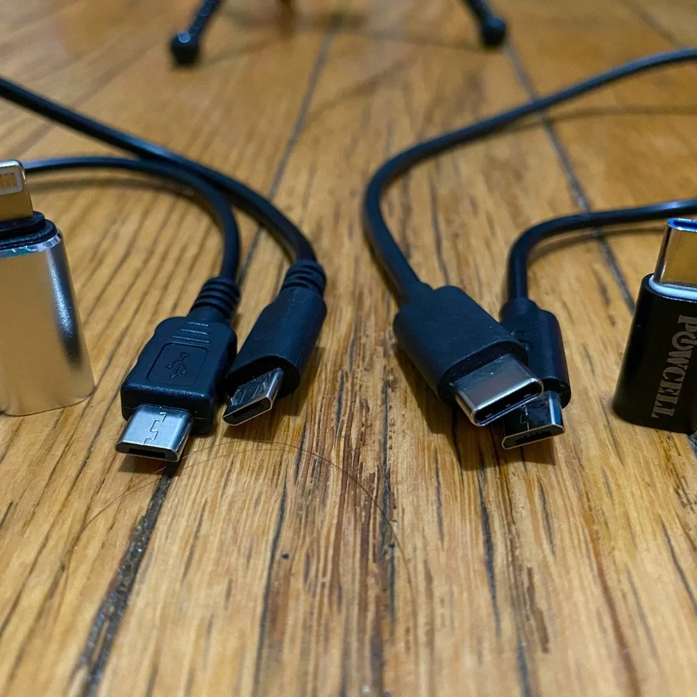 Phone tripod and various charging cables and adapters
